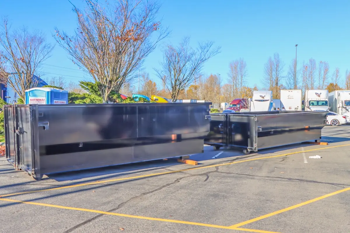 Professional dumpster rental service with roll-off container on residential driveway in Cape Coral